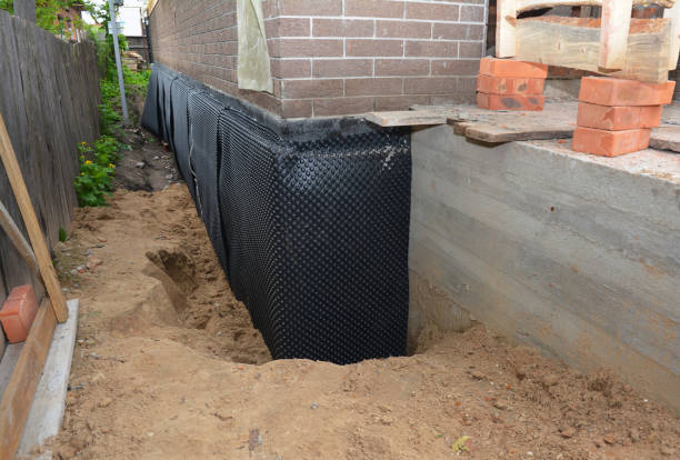 SJ Waterproofing Pros technician performing targeted Waterproofing assessment in Millersburg, OH